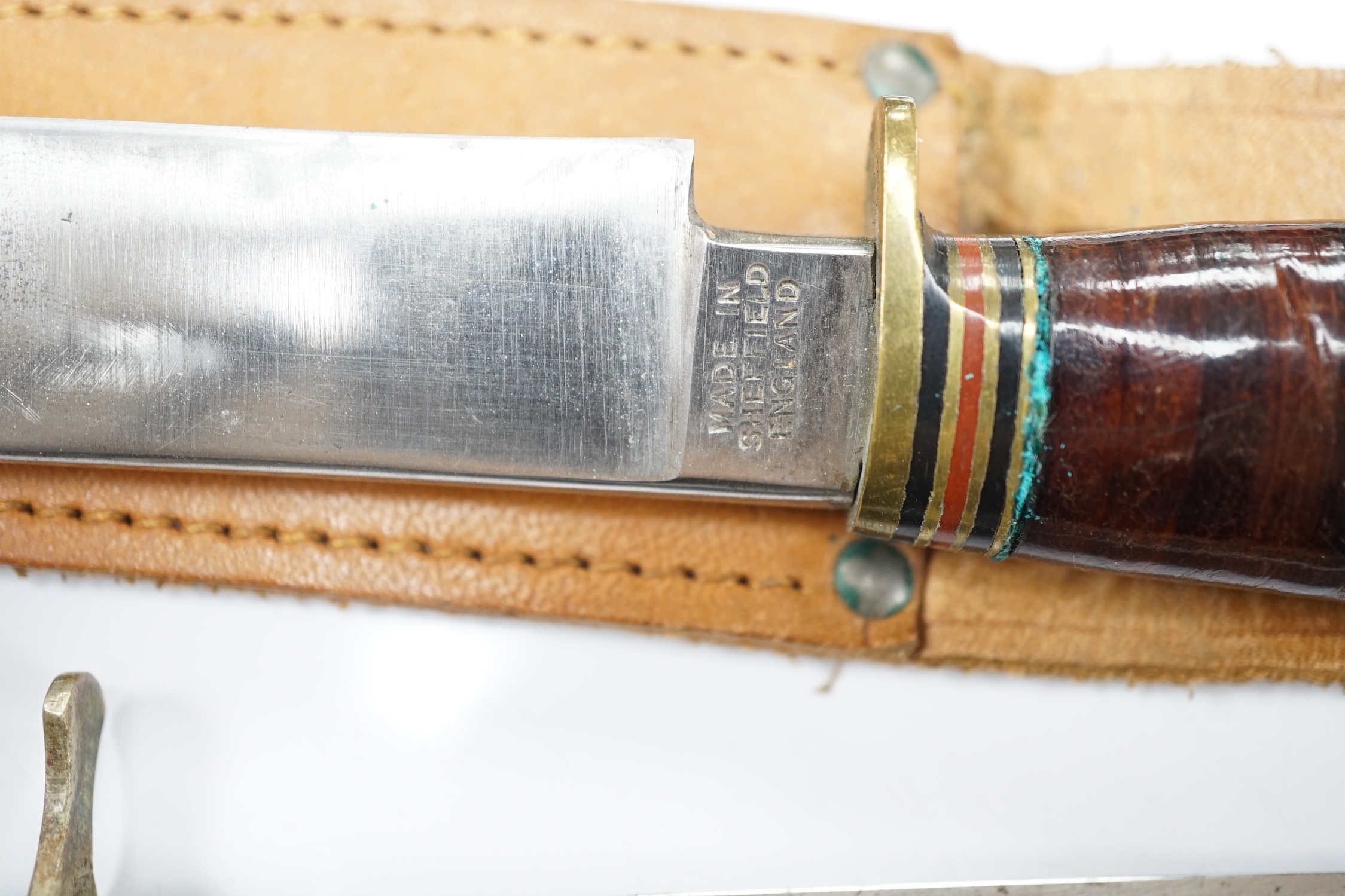 Two antler-handled hunting knives and three other knives